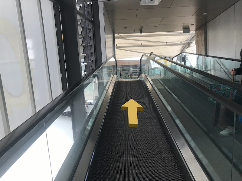 Indoor escalator going up to the first level of the Skywalk.